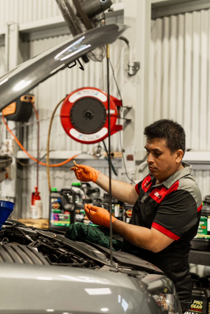 Professional car repair Brisbane - LeMans Motors mechanic diagnosing engine issues