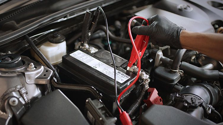How Long Should a Car Battery Last in Australia? What Drivers Need to Know 1 Car battery being replaced by Brisbane mechanic